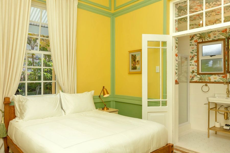 The yellow room with its open door to the bathroom