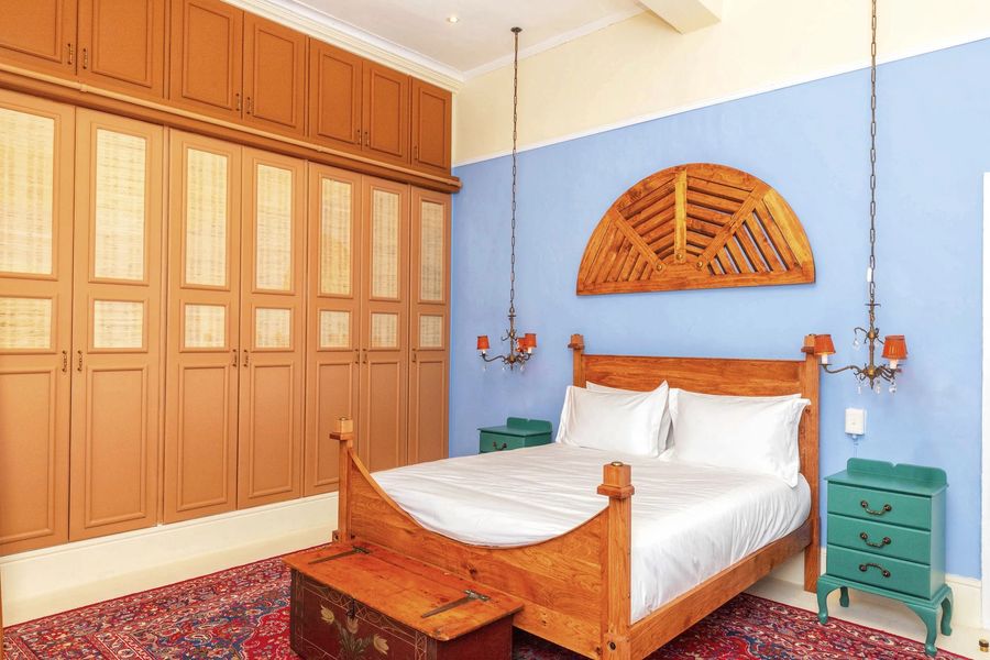 The blue room with its wall of wooden wardrobes