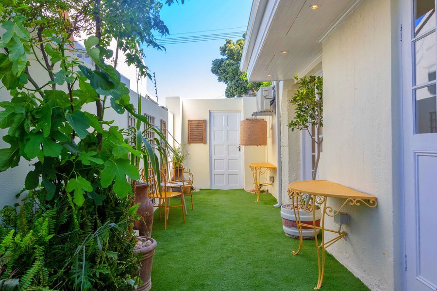 The private patio: a strip of lawn and plants beside the suite